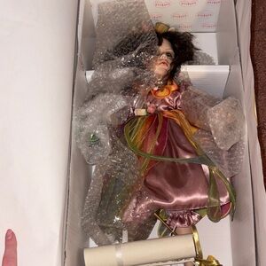 Elegant Porcelain Doll in Pink and Green Dress